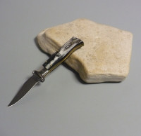 Coltello a scatto Cm.19,50 Mod.Calibro con estrattore di cartucce Corno di bufalo brasilian naturale/3 - Italian stiletto